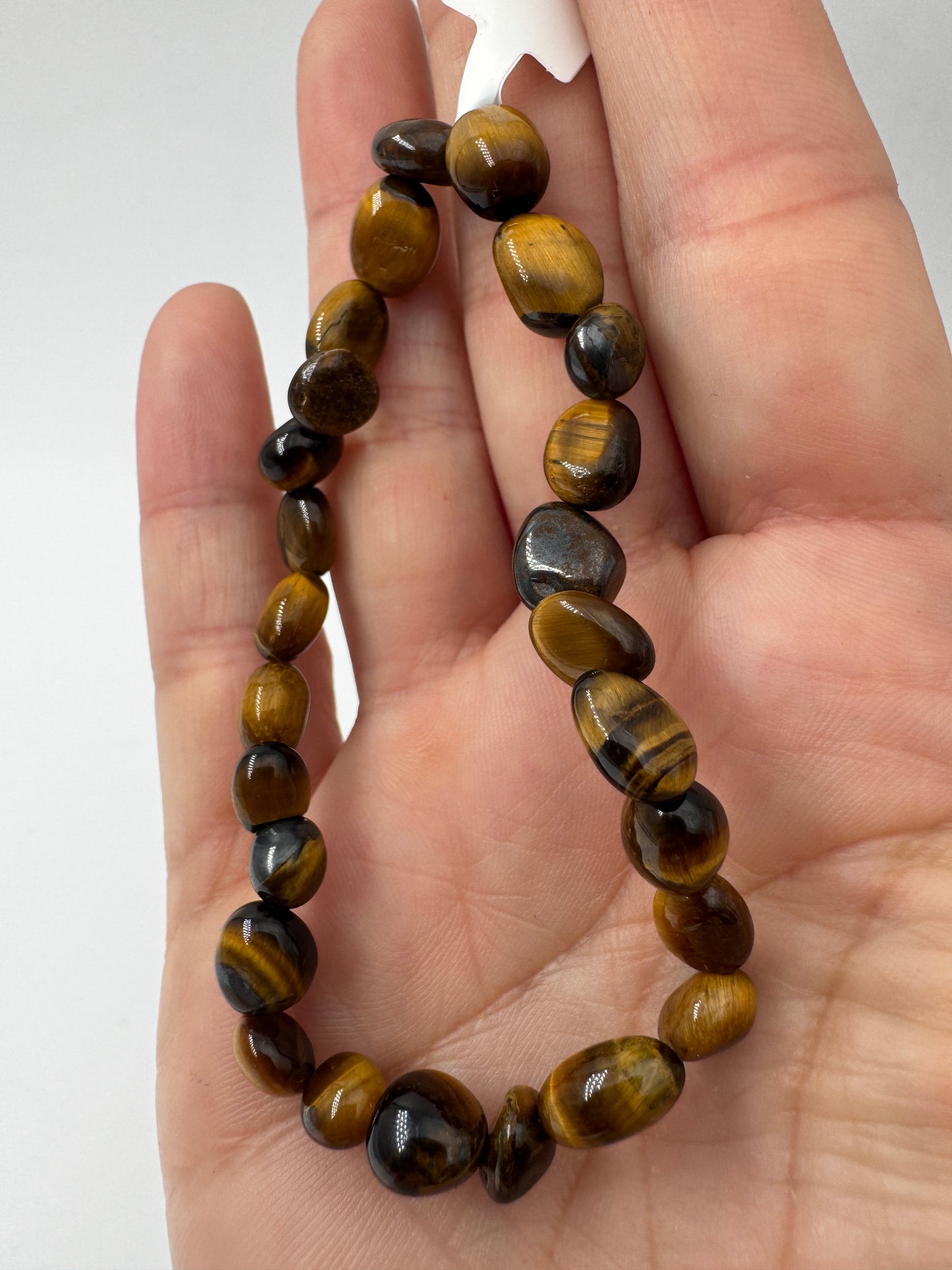 Ein hochwertiges Armband aus braun-goldenem Tigerauge.
